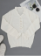 Dámský elegantní bílý pletený svetr s volánky